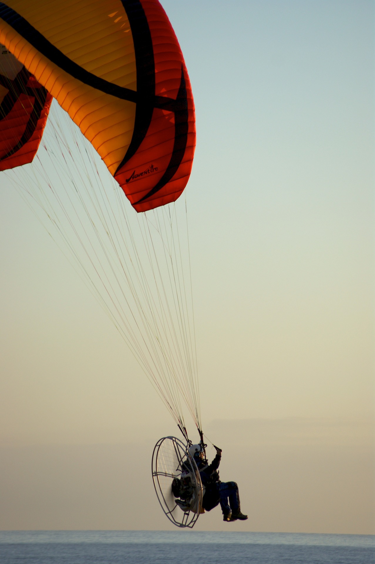 A picture of a man paragliding