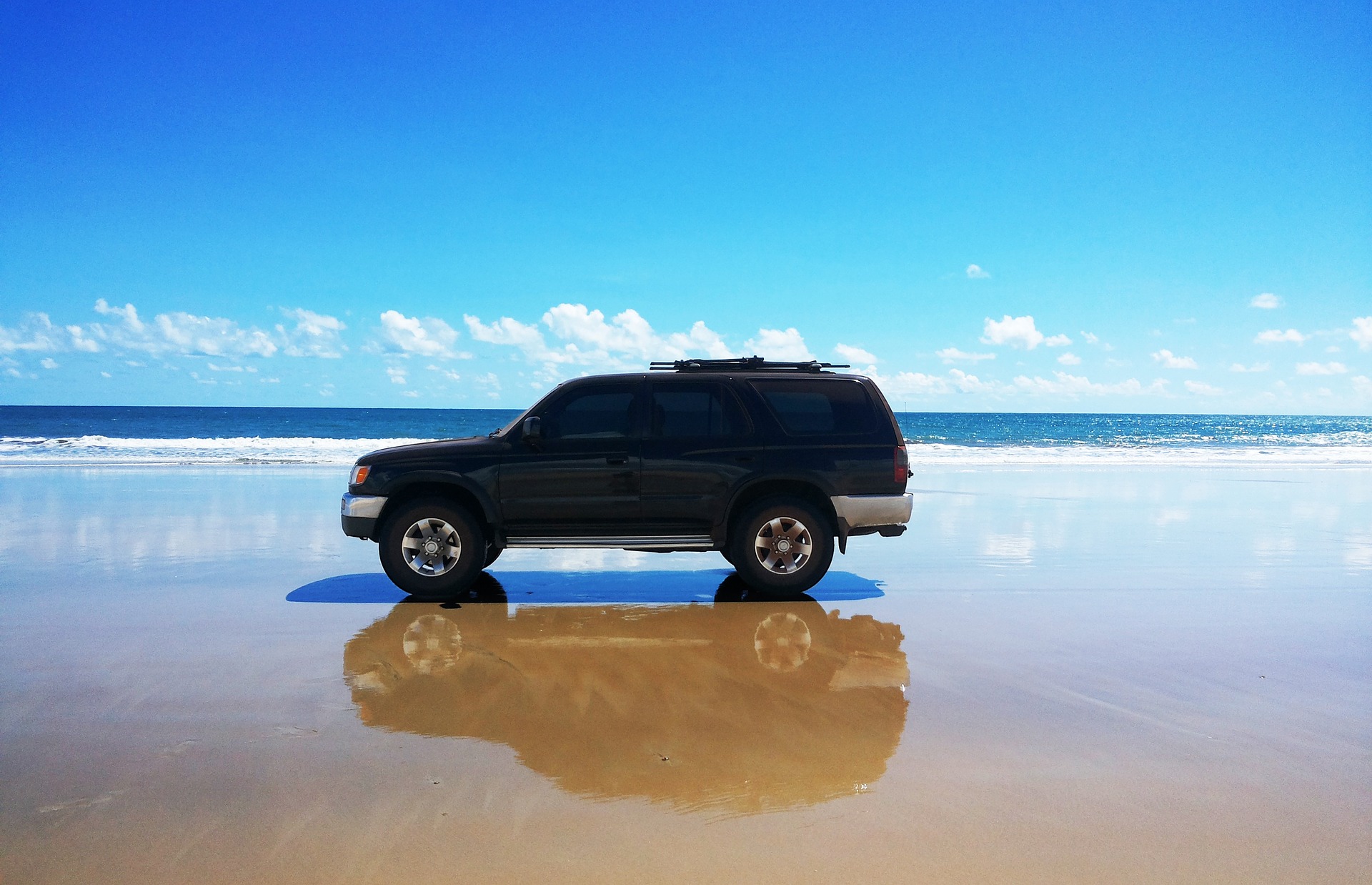 A picture of a jeep on a beach